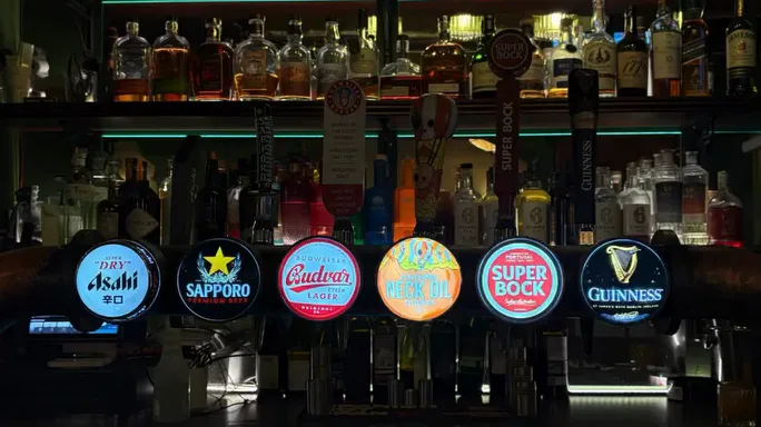 The beer taps at Wildes: Asahi, Sapporo, Budvar, Neck Oil, Super Bock and Guinness